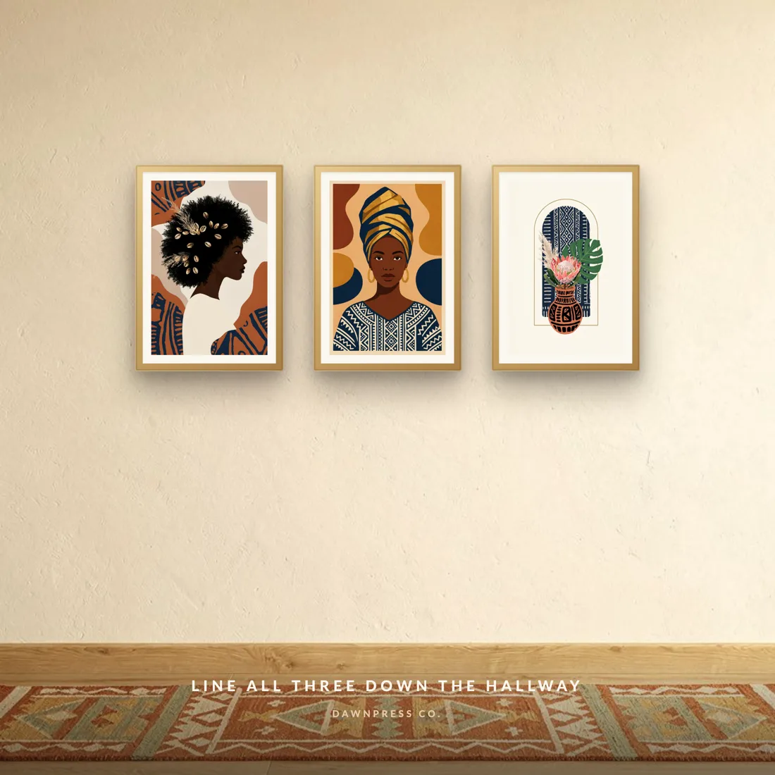 Two Afrohemian portrait prints in gold frames along a warm hallway wall